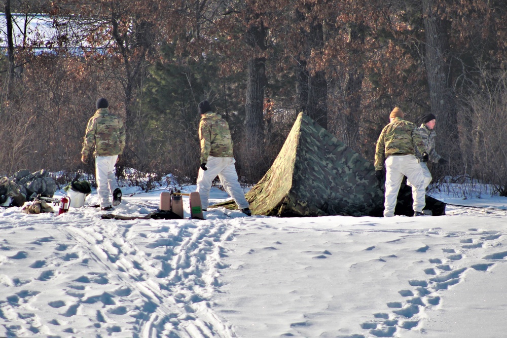 Cold-Weather Operations Course class 22-03 students build Arctic tents on Fort McCoy's South Post