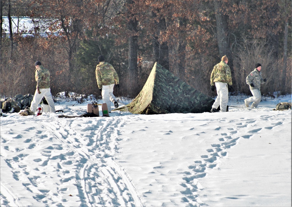 Cold-Weather Operations Course class 22-03 students build Arctic tents on Fort McCoy's South Post