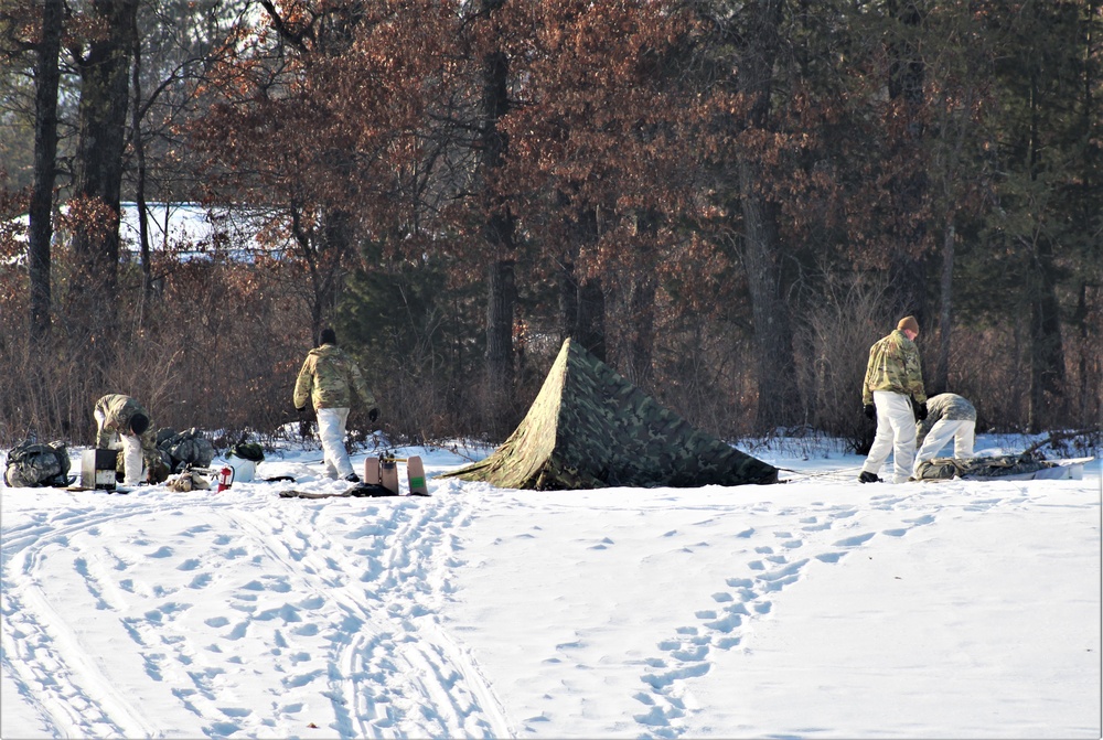 Cold-Weather Operations Course class 22-03 students build Arctic tents on Fort McCoy's South Post