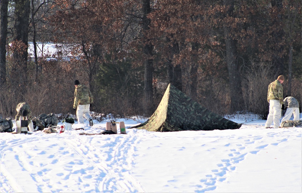 Cold-Weather Operations Course class 22-03 students build Arctic tents on Fort McCoy's South Post