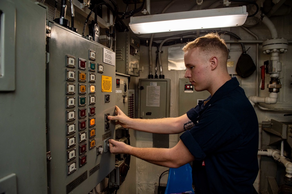 USS Carl Vinson (CVN 70) Sailor Operates a Weapons Elevator