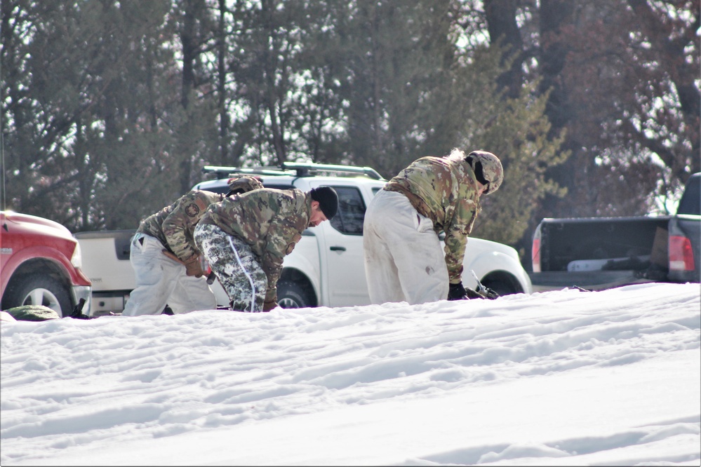 Cold-Weather Operations Course class 22-03 students build Arctic tents on Fort McCoy's South Post