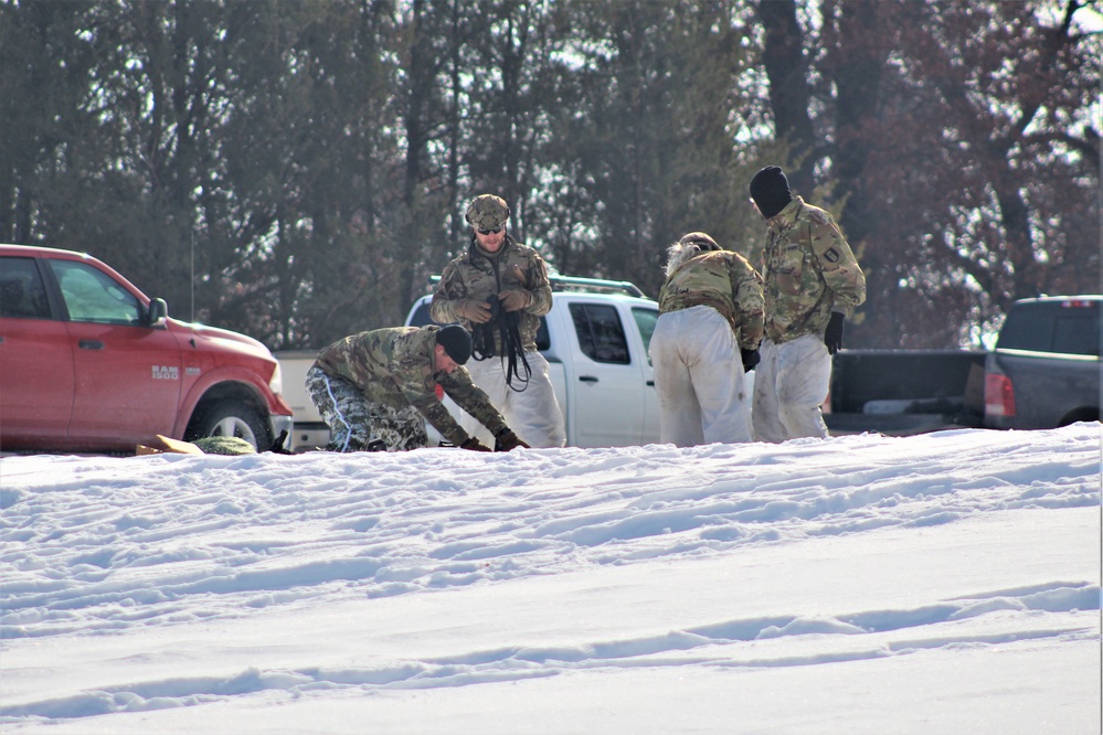 Cold-Weather Operations Course class 22-03 students build Arctic tents on Fort McCoy's South Post