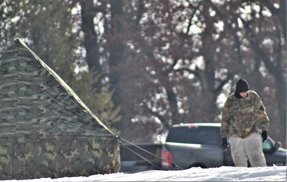 Cold-Weather Operations Course class 22-03 students build Arctic tents on Fort McCoy's South Post