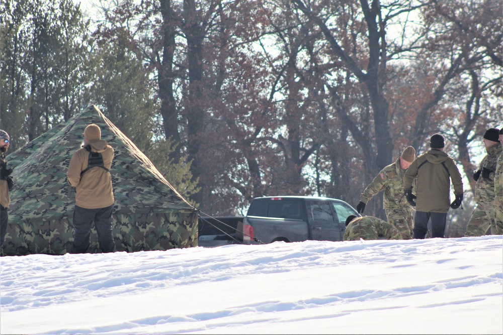 Cold-Weather Operations Course class 22-03 students build Arctic tents on Fort McCoy's South Post