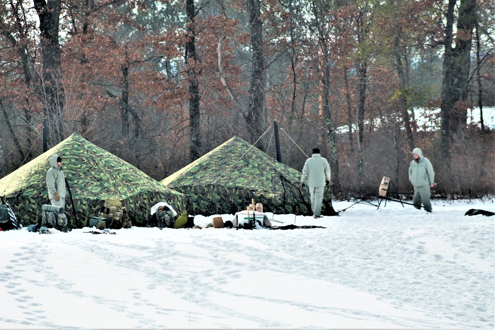 Cold-Weather Operations Course class 22-03 students build Arctic tents on Fort McCoy's South Post