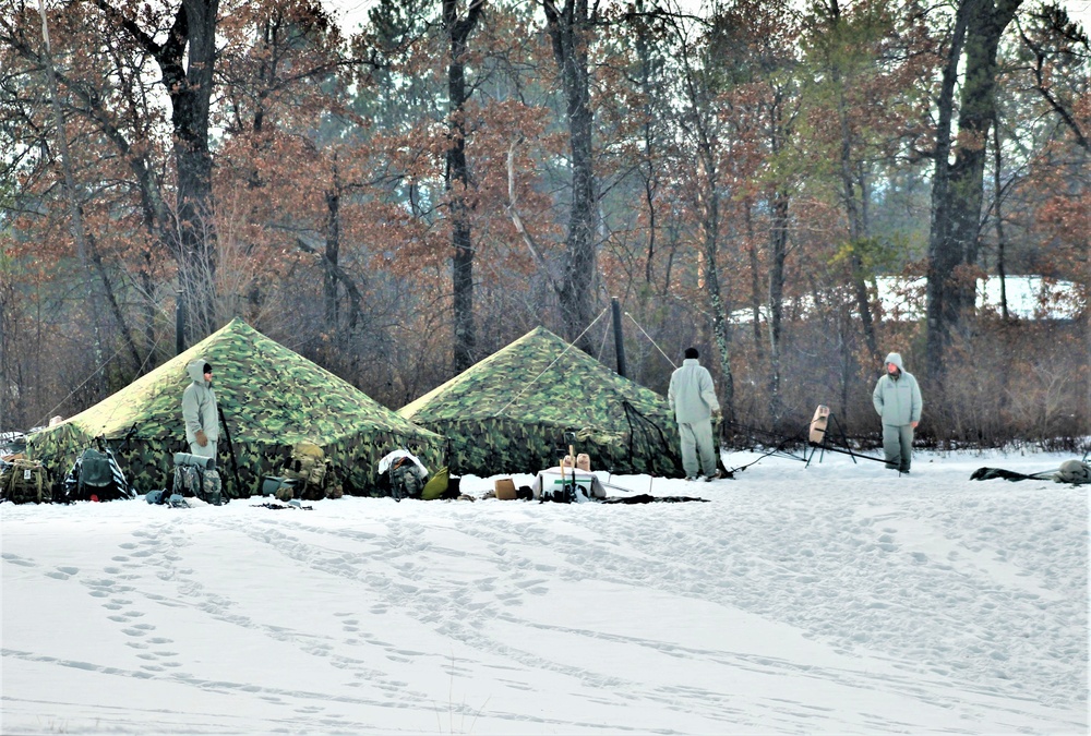 Cold-Weather Operations Course class 22-03 students build Arctic tents on Fort McCoy's South Post