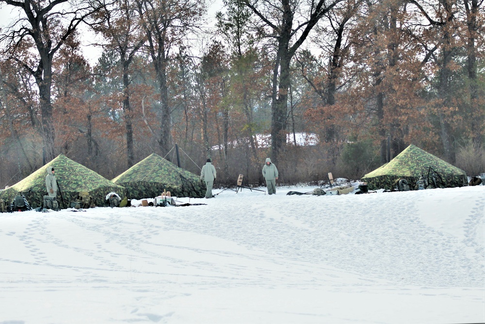 Cold-Weather Operations Course class 22-03 students build Arctic tents on Fort McCoy's South Post