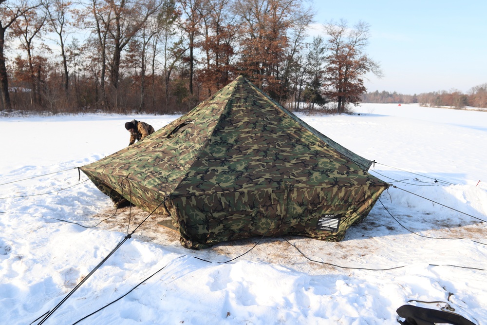 Cold-Weather Operations Course class 22-03 students build Arctic tents on Fort McCoy's South Post