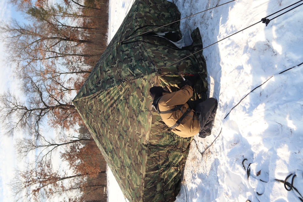 Cold-Weather Operations Course class 22-03 students build Arctic tents on Fort McCoy's South Post