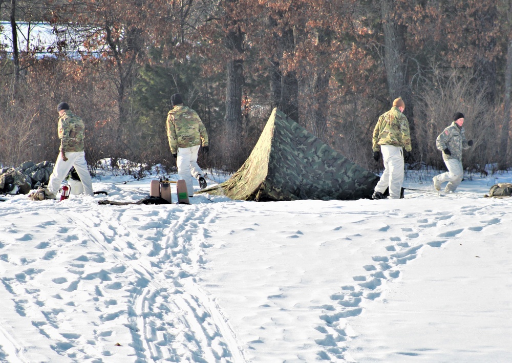 Cold-Weather Operations Course class 22-03 students build Arctic tents on Fort McCoy's South Post