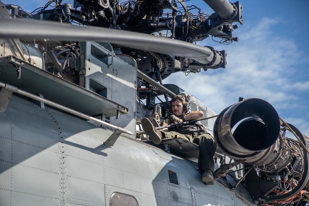 CH-53E deep cleaning aboard USS Portland