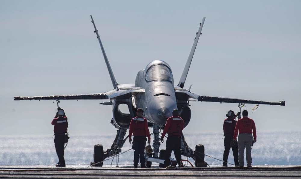 Sailors Chain Down Aircraft During Drill