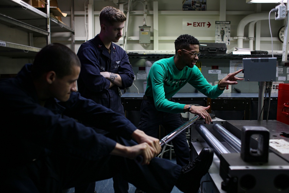 Abraham Lincoln Sailors calibrate tools