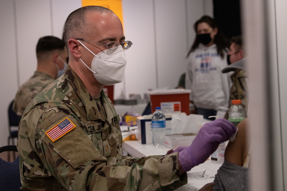 Army and Air National Guardsmen volunteer to administer COVID-19 vaccinations