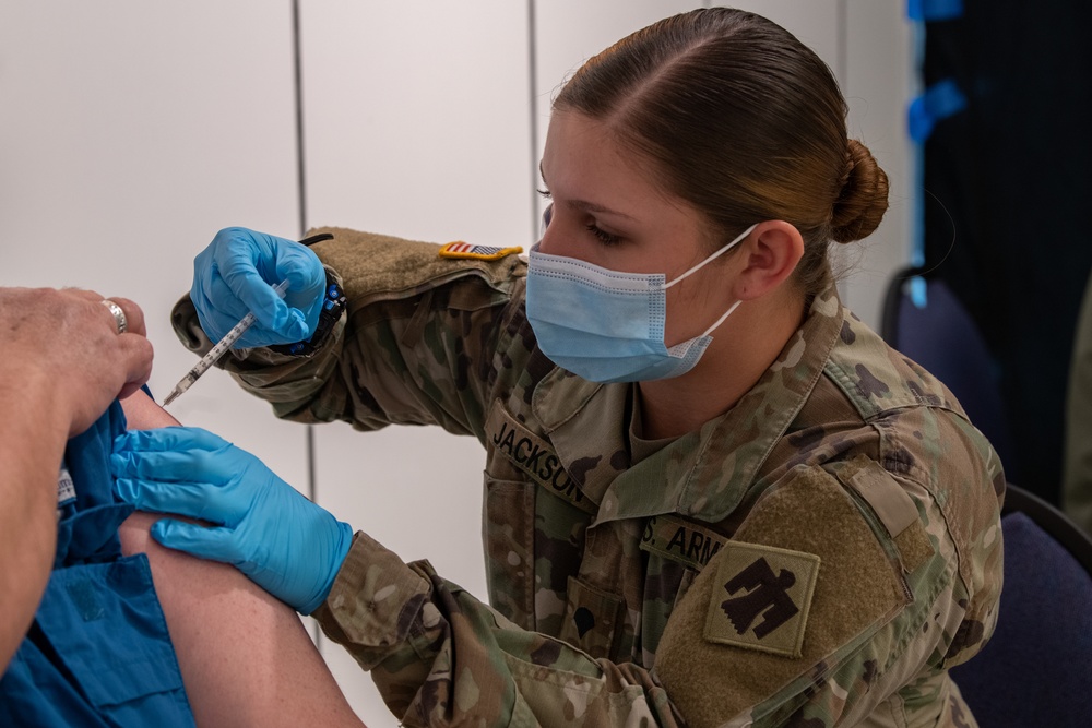 Army and Air National Guardsmen volunteer to administer COVID-19 vaccinations