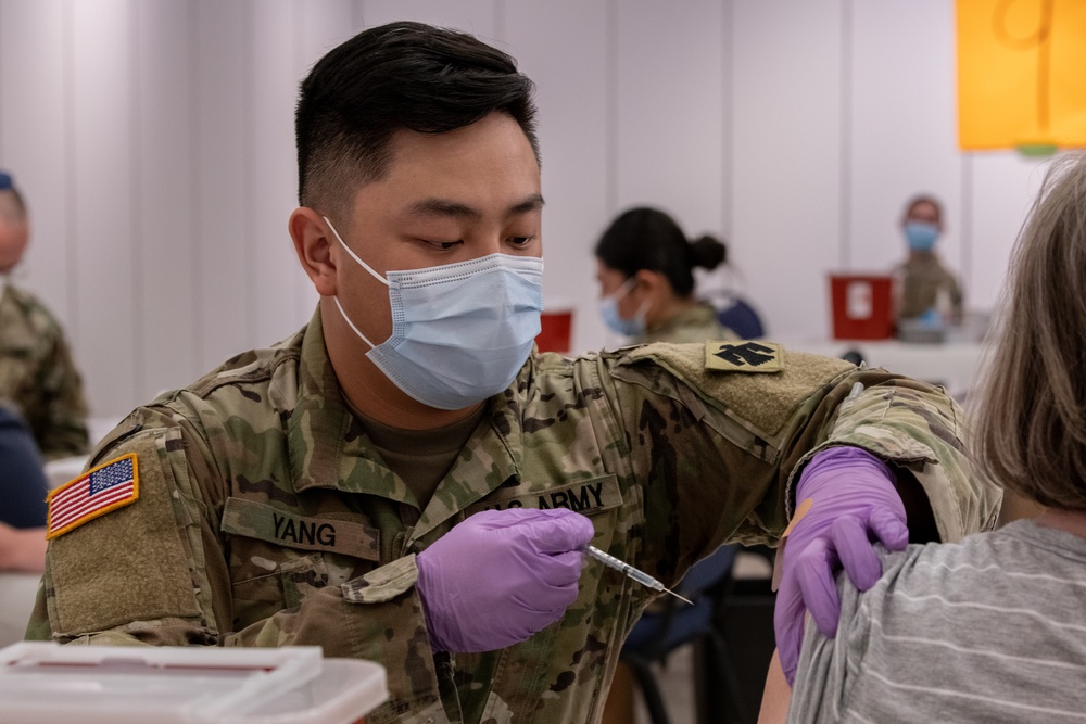 Army and Air National Guardsmen volunteer to administer COVID-19 vaccinations