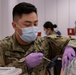 Army and Air National Guardsmen volunteer to administer COVID-19 vaccinations