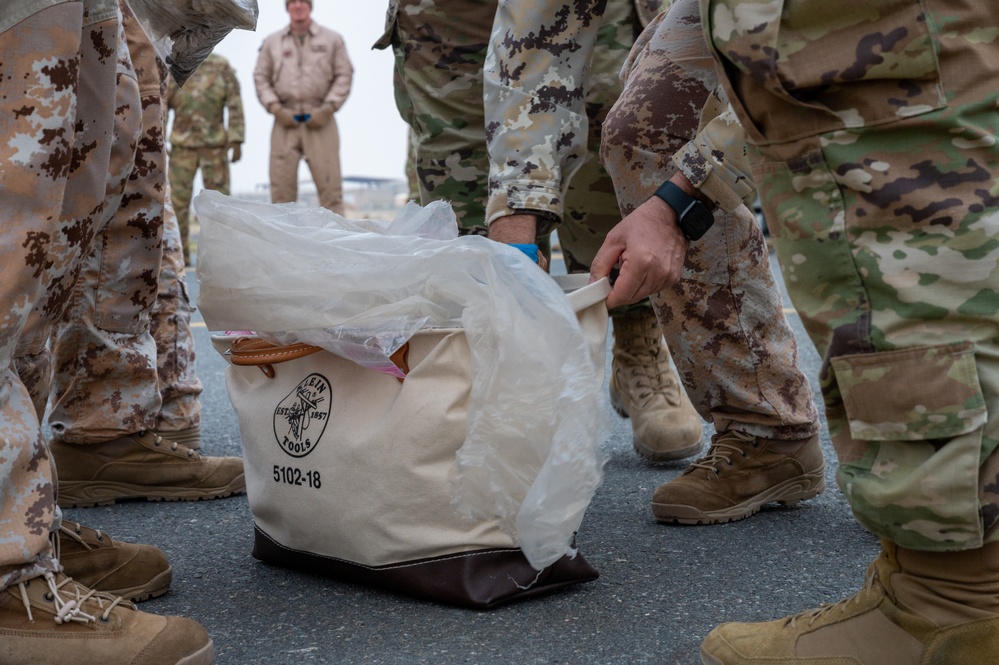 Sweeping the flight line: 386th Expeditionary Maintenance Squadron's weekly FOD walk