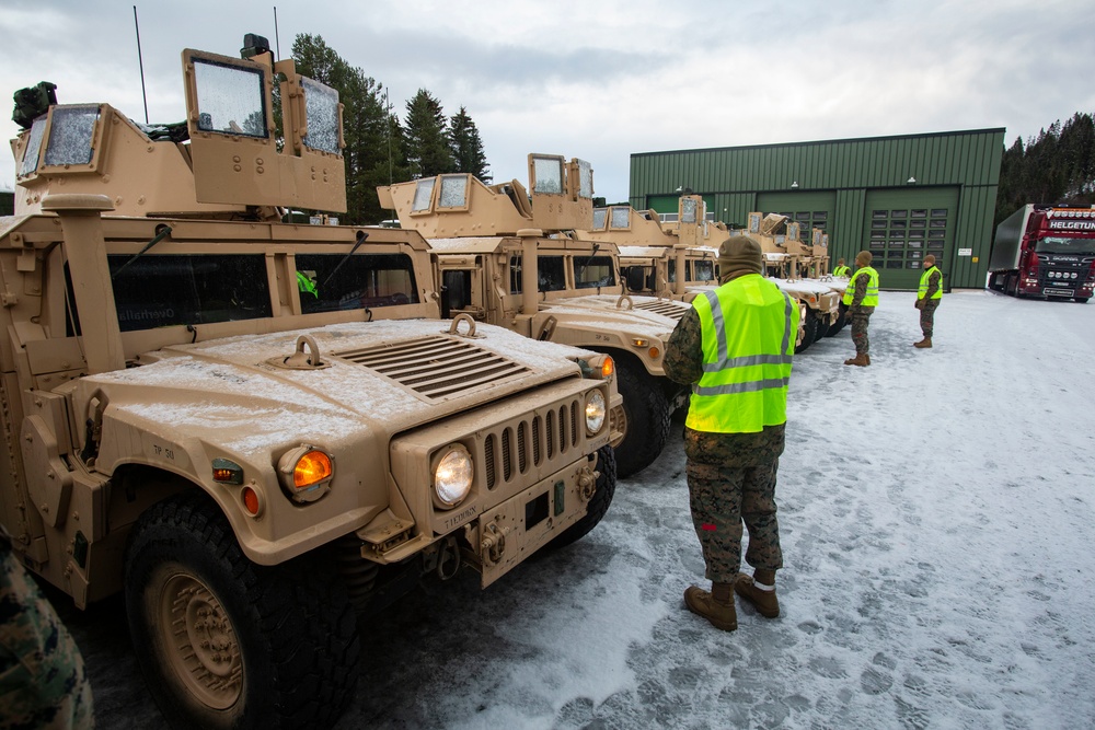 Marines prepare vehicles for a convoy movement prior to Exercise Cold Response 2022