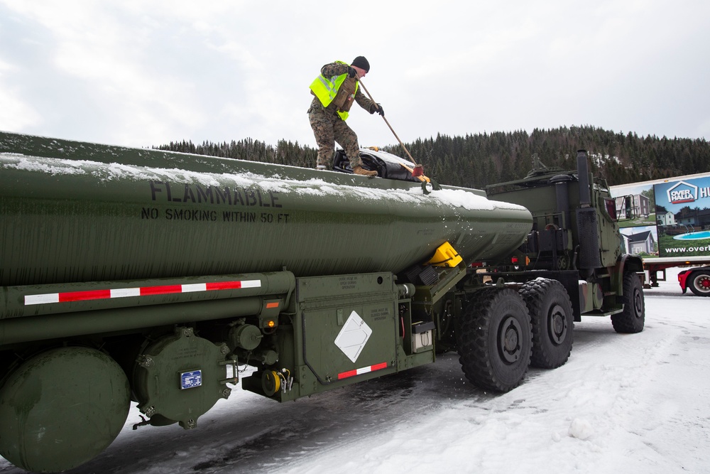 Marines prepare vehicles for a convoy movement prior to Exercise Cold Response 2022