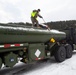 Marines prepare vehicles for a convoy movement prior to Exercise Cold Response 2022