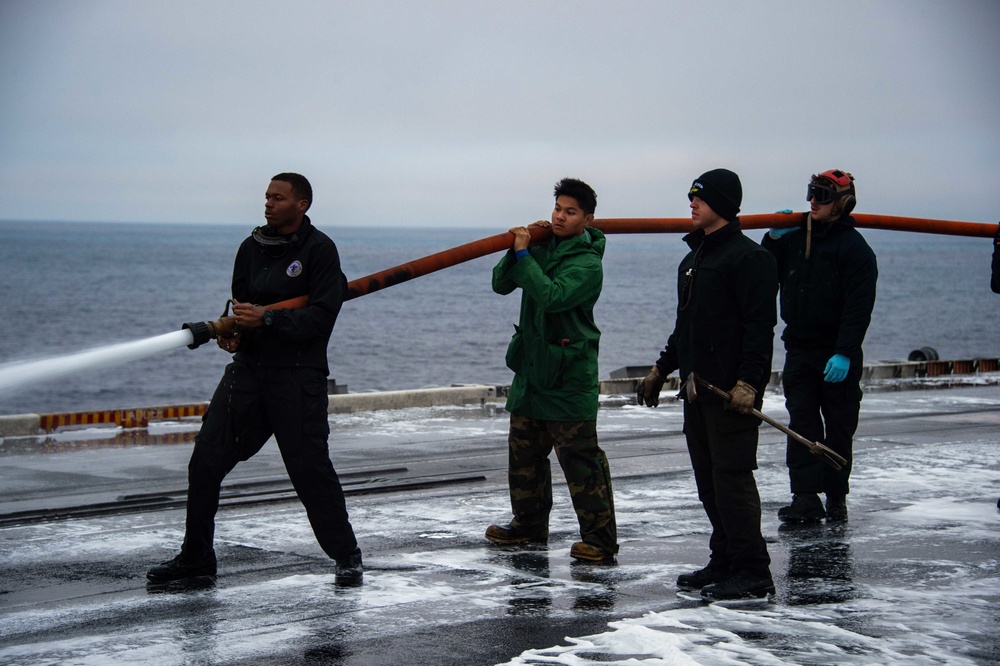 USS Carl Vinson (CVN 70) Sailors Clean The Flight Deck