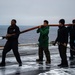 USS Carl Vinson (CVN 70) Sailors Clean The Flight Deck