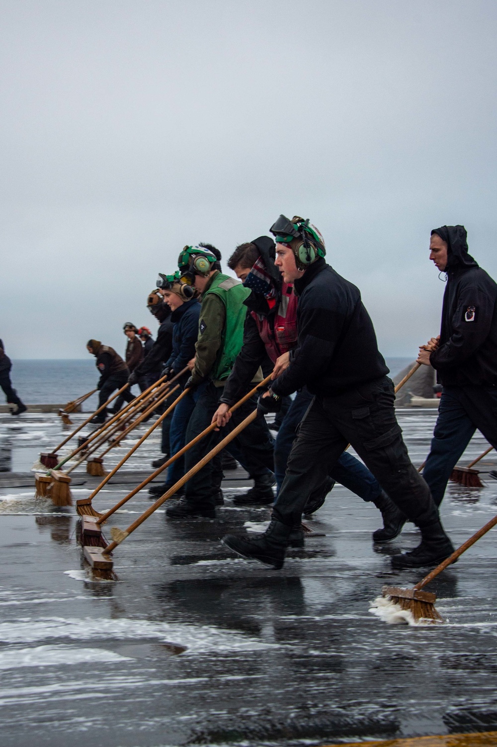 USS Carl Vinson (CVN 70) Sailors Clean The Flight Deck