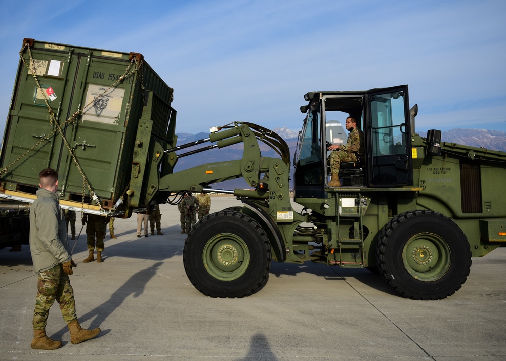 724th Air Mobility Squadron Airmen load pallets on C-130J Super Hercules