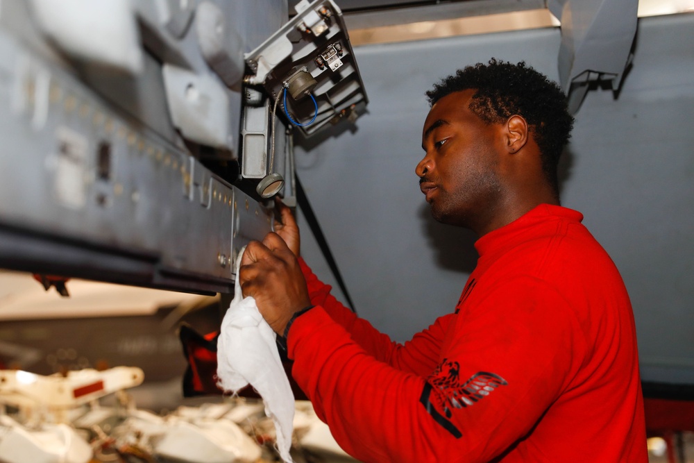 Abraham Lincoln Sailors conduct aircraft maintenance