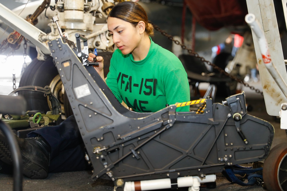 Abraham Lincoln Sailors conduct aircraft maintenance