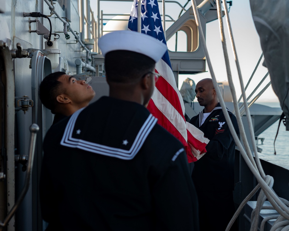 USS Carl Vinson (CVN 70) Sailors Raise Ensign
