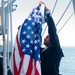 USS Carl Vinson (CVN 70) Sailor Raises Ensign