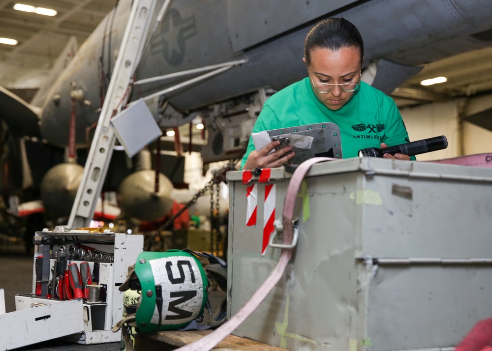 Abraham Lincoln Sailors conduct aircraft maintenance