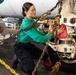 Abraham Lincoln Sailors conduct aircraft maintenance