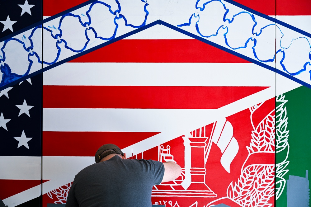 TF-L members and guests paint mural depicting journey
