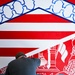 TF-L members and guests paint mural depicting journey