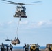 USS America conducts a vertical replenishment with the fleet replenishment oiler USNS Yukon (T-AO 202).