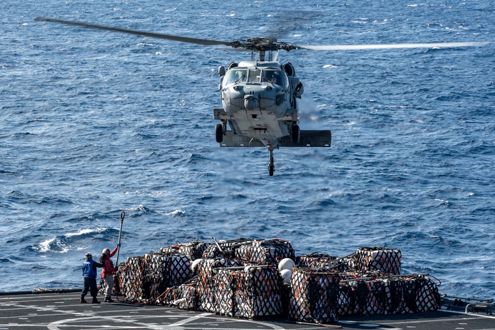 USS America conducts a vertical replenishment with the fleet replenishment oiler USNS Yukon (T-AO 202).