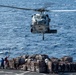 USS America conducts a vertical replenishment with the fleet replenishment oiler USNS Yukon (T-AO 202).