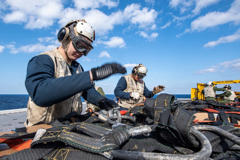 USS America conducts a vertical replenishment with the fleet replenishment oiler USNS Yukon (T-AO 202).