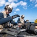 USS America conducts a vertical replenishment with the fleet replenishment oiler USNS Yukon (T-AO 202).