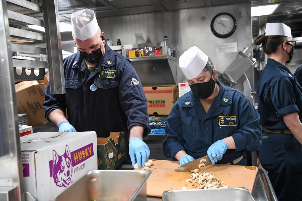 USS Momsen Sailors Serve Food