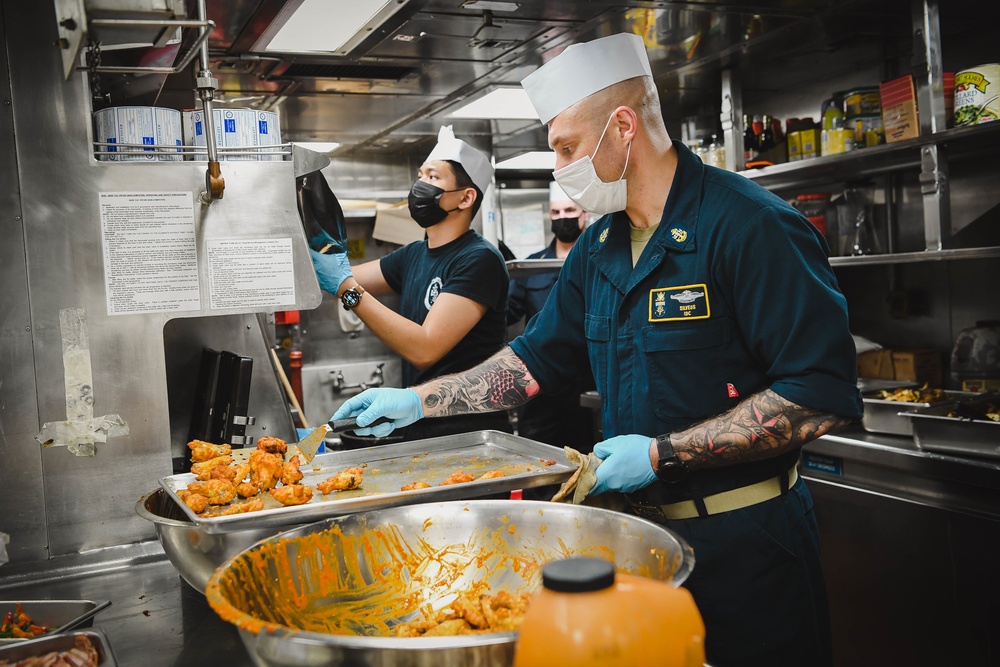 USS Momsen Sailors Serve Food