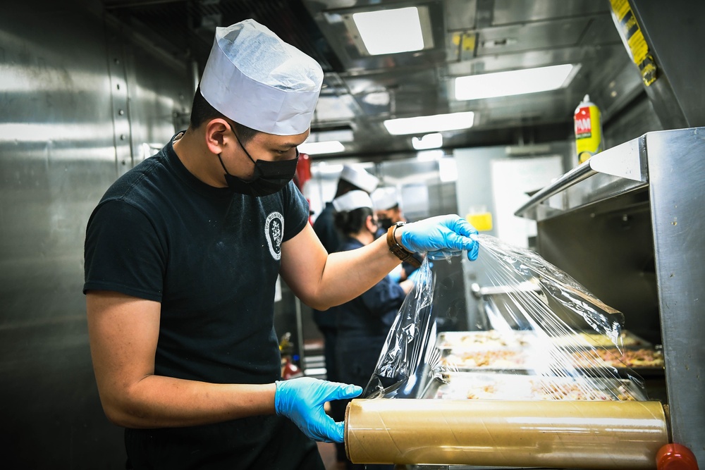 USS Momsen Sailors Serve Food