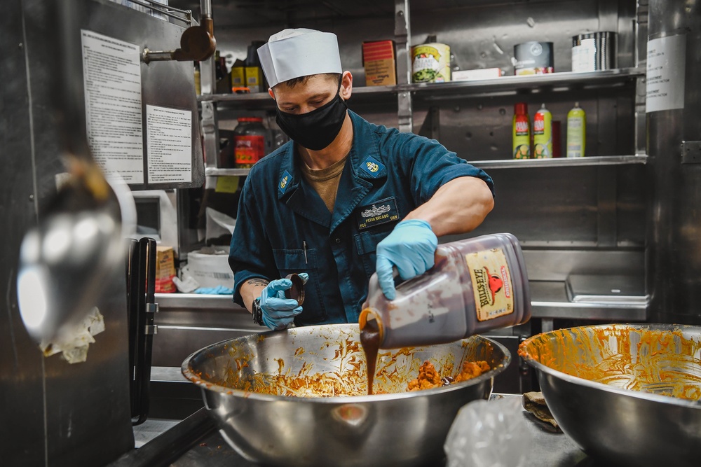 USS Momsen Sailors Serve Food