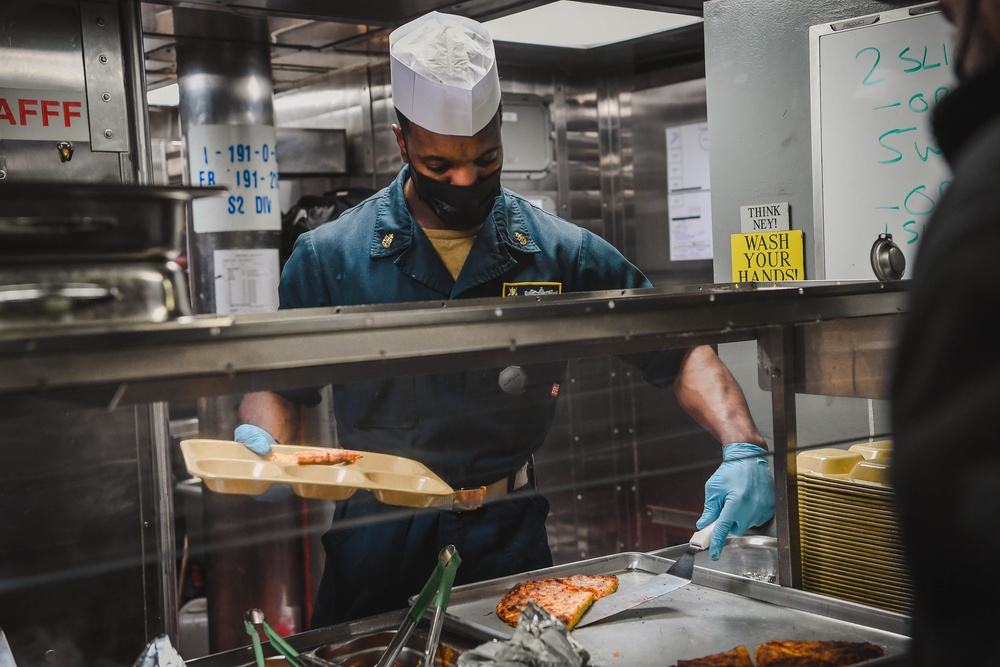 USS Momsen Sailors Serve Food