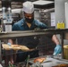 USS Momsen Sailors Serve Food
