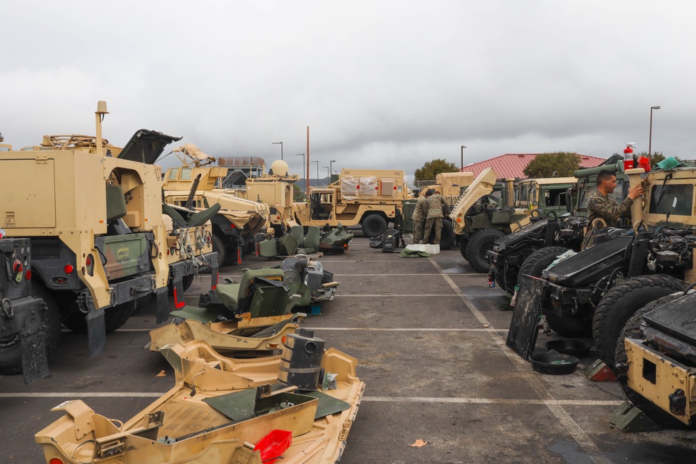 Marines with 5th Marine Regiment prepare vehicles for inspection